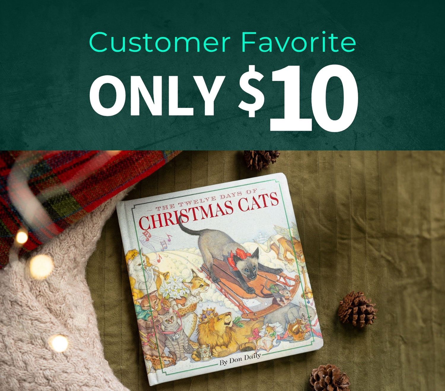 Children's book titled 'The Twelve Days of Christmas Cats' on a wooden surface with decorative elements. Customer Favorite only $10